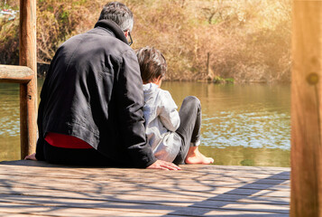 Father and son while spending the fathers day together in a sustainable lifestyle in the nature