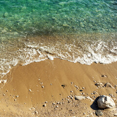 Sandy beach and ocean waves. Beautiful tropical sea in the morning summer season. Space  for using advertisement of traveling, vacation, resort. Mediterranean style. Background. 