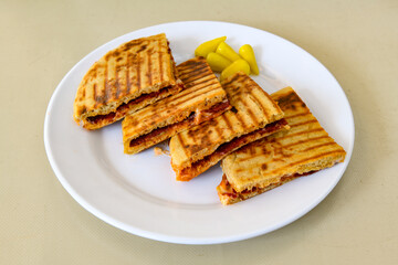 Turkish karisik atom Ayvalik tost ( kasarli bazlama tost) . Sucuklu, Kasarli, kavurmali karisik tost. Flat baked bread toasted
