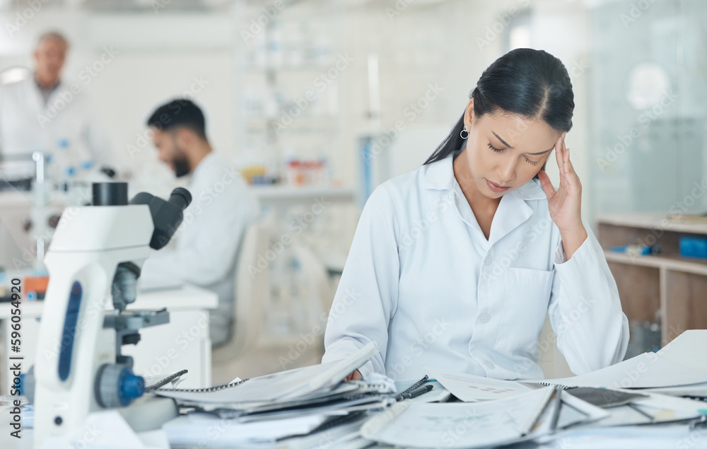 Poster Ive been at this for so long already. a young scientist looking stressed out while working in a lab.