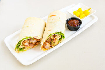 Lavash doner kebab ( zurna doner durum )  or shawarma sliced in plate isolated. 