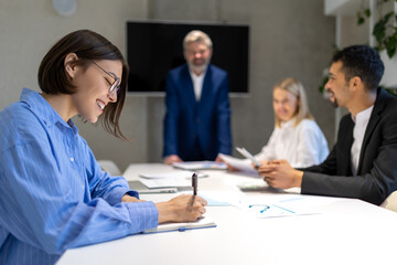 Business partners having negotiations and signing the contract
