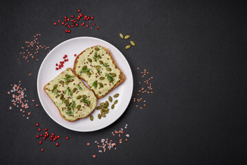 Grilled toast with avocado paste, eggs, cream cheese, salt, spices and herbs