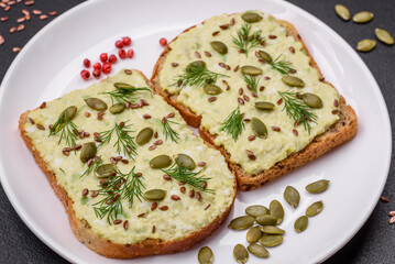 Grilled toast with avocado paste, eggs, cream cheese, salt, spices and herbs