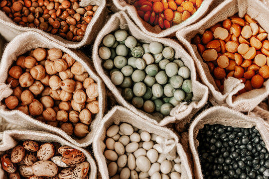 Various types of legumes in linen bags.Top view.