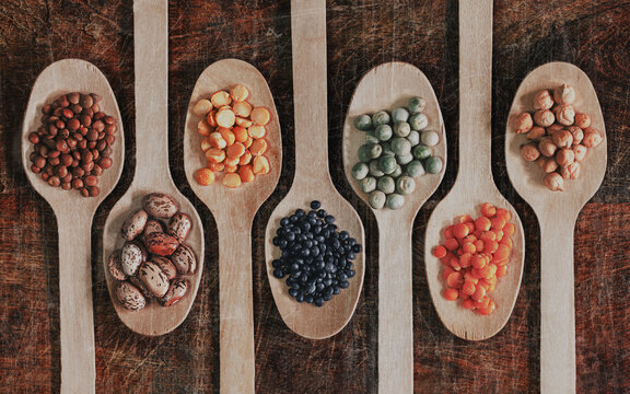 Assortment of colorful legumes on wooden spons