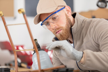 technician or worker man hold copper pipe