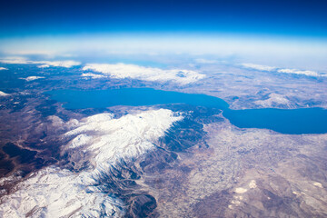 Beautiful earth and sea from a window airplane background © Kostia