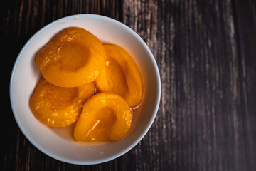 Ripe and Juicy Peaches on Wooden Background