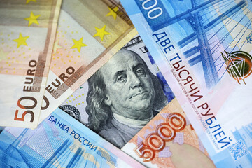 US dollars, Russian rubles and Euro banknotes. American and european economic, sanctions against Russia, exchange rate
