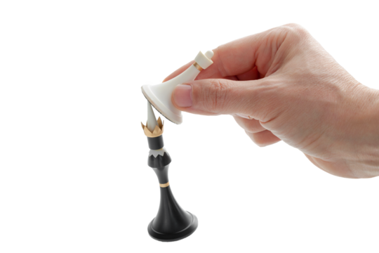 The hand holding the chess piece, the pawn beats the king, Checkmate, Business concept strategy, leadership, victory of white over black, cut out