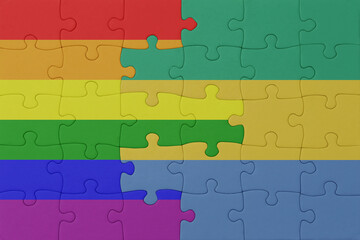 Fototapeta premium puzzle with the flag of rainbow gay pride and gabon . macro.concept.