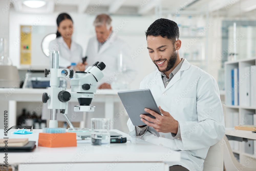 Aufkleber Writing up a quick summary in digital form. a young scientist using a digital tablet while working in a lab.