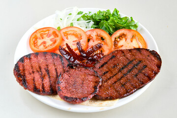 Grilled chili, tomato and sucuk between bread. ( Sucuk ekmek ) 