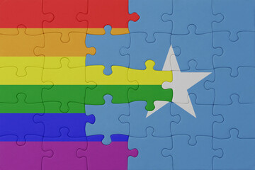 puzzle with the flag of rainbow gay pride and somalia . macro.concept.