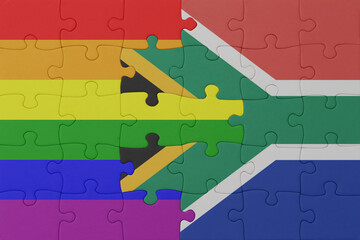 puzzle with the flag of rainbow gay pride and south africa . macro.concept. © luzitanija