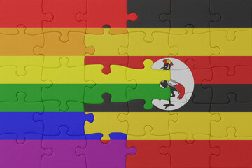 puzzle with the flag of rainbow gay pride and uganda . macro.concept.