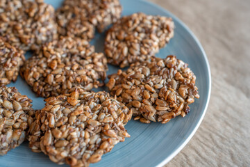 Vegan cookies made of banana and different seeds, photographed with natural light