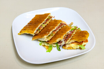 Turkish karisik atom Ayvalik tost ( kasarli bazlama tost) . Sucuklu, Kasarli, kavurmali karisik tost. Flat baked bread toasted