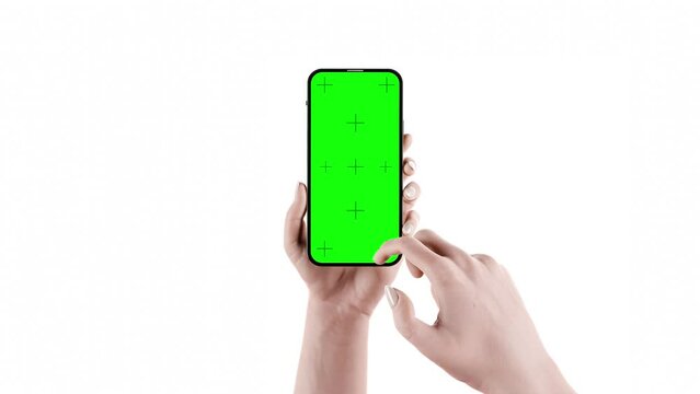 A woman's hand holds a smartphone with an empty screen - animation of scrolling through the content of the application - fast scrolling. The video clip includes screen and background masking