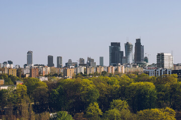 Observation deck with binoculars and a view of a modern business center with office buildings:Warsaw/Poland-22 April 2023