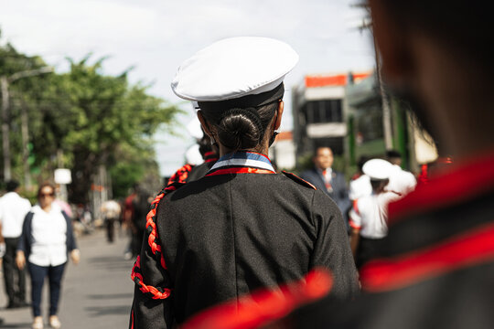 Younger group of a military school in formation to patriot parade of Honduras wearing military clothing and hats.