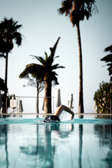 Fototapeta na wymiar Person swimming in a pool