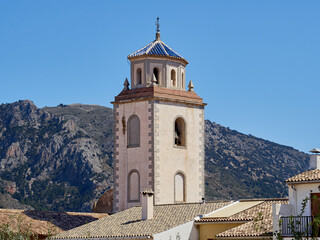 Fototapeta na wymiar Bell tower of the church of San Vicente Mártir (Sant Vicent Martir) in Benimantell, a town and municipality located in Marina Baixa, in the province of Alicante. Valencian community, Spain
