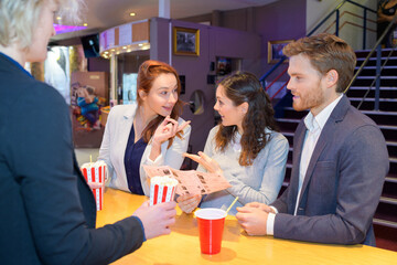 friends socializing in a cinema lobby lounge