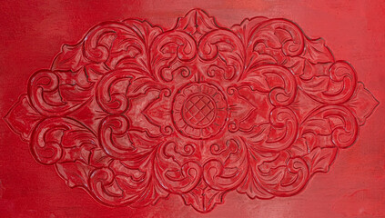 Obraz na płótnie Canvas Flower design on red carved door background and wallpaper texture