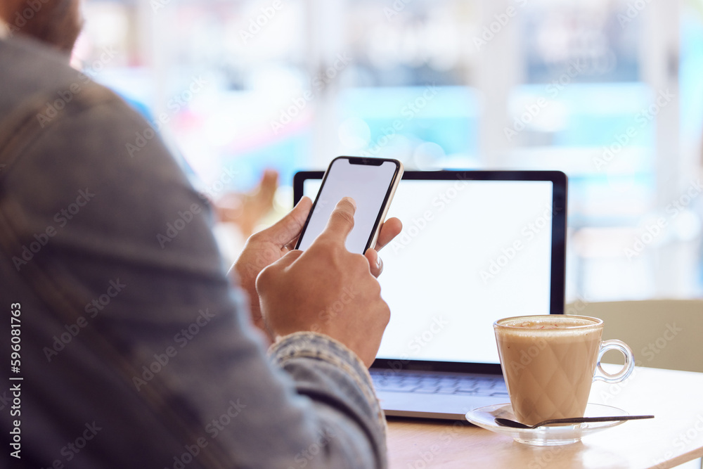 Aufkleber Getting the work done. a man using his smartphone and laptop to work in a coffee shop while enjoying a cup of coffee.