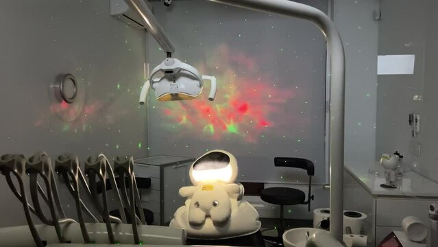 dental space office beautiful decor on wall light dark romance no one is empty soft toy sitting in a chair on a white pillow latest technology relaxation comfort