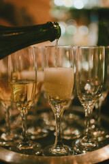 Champagne being poured for wedding toasts