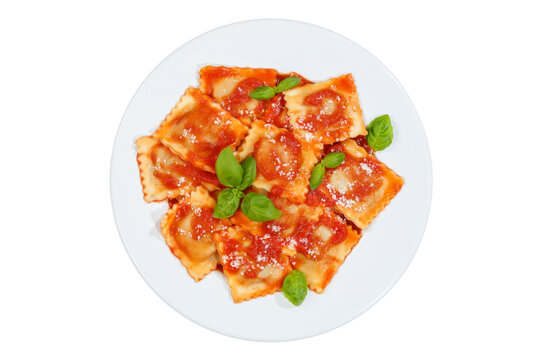 Ravioli pasta meal isolated on a white background top view from Italy for lunch dish with tomato sauce on a plate