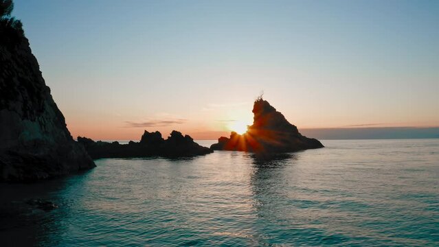 Sunset over the sea and the rocks