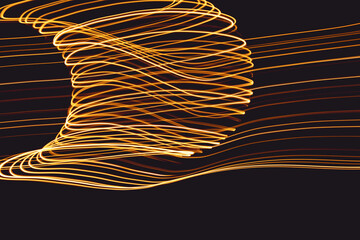 Abstract lights of golden colors forming patterns of curved lines. Festive decoration.