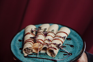 chocolate candy on a red plate