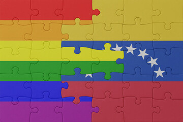 puzzle with the flag of rainbow gay pride and venezuela . macro.concept.