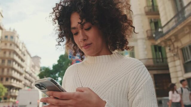 Close up, young woman uses a taxi app