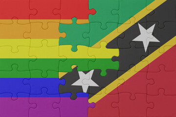 puzzle with the flag of rainbow gay pride and saint kitts and nevis . macro.concept.