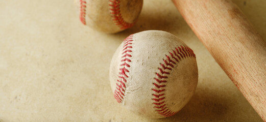 Vintage baseball equipment on tan texture background for sport.
