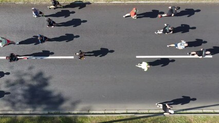 23rd of April 2023, Belgrade, Serbia Aerial drone photo view of people running a marathon in the city. From above.