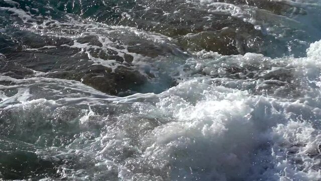 Stormy beautiful waves are crushing on huge rocks on the sea coast in Cadiz.