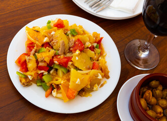 Malaga salad - orange pulp, tomatoes and bell peppers. Spanish cuisine