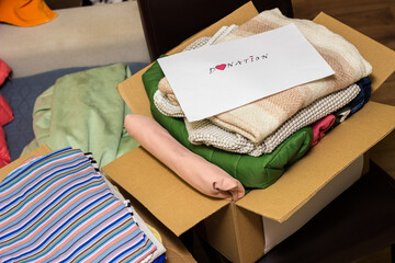 Donating winter clothes to those in need. Warming Hearts