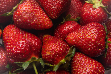 Red ripe strawberries background. Close up, top view.