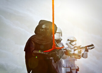 Naklejka premium BLOOMFIELD NJ - JAN 24 2016: Kylo Ren and stormtrooper action figures recreate a winter scene from Starkiller Base from Star Wars: The Force Awakens. Lens Flare effect.