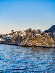 Obraz premium Waterfront houses of Eidsvag on a rocky mountain, Bergen, Vestland, Norway
