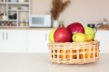Fruit basket on dining table in kitchen