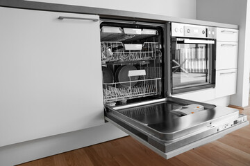 Open dishwasher in modern kitchen
